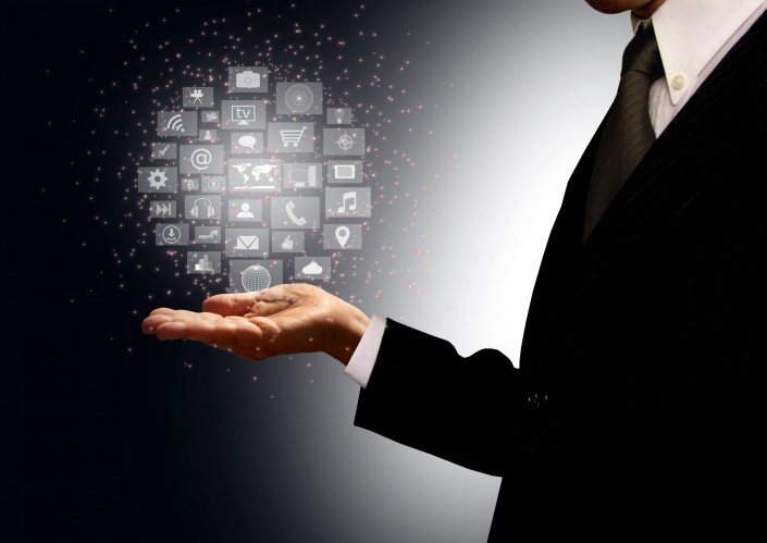 Businessman holding information technology hologram in his palm